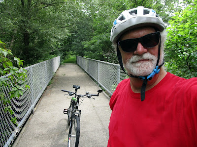 Biker on bridge.