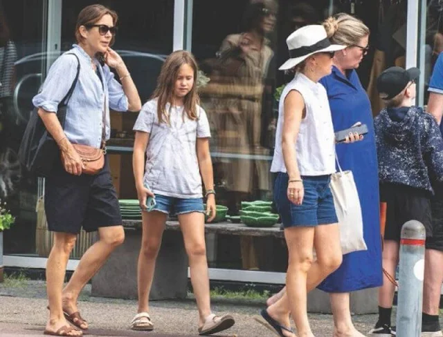Crown Princess Mary wore a ruffle mock neck striped blouse by ba&sh. Princess Josephine wore a t-shirt by Ganni