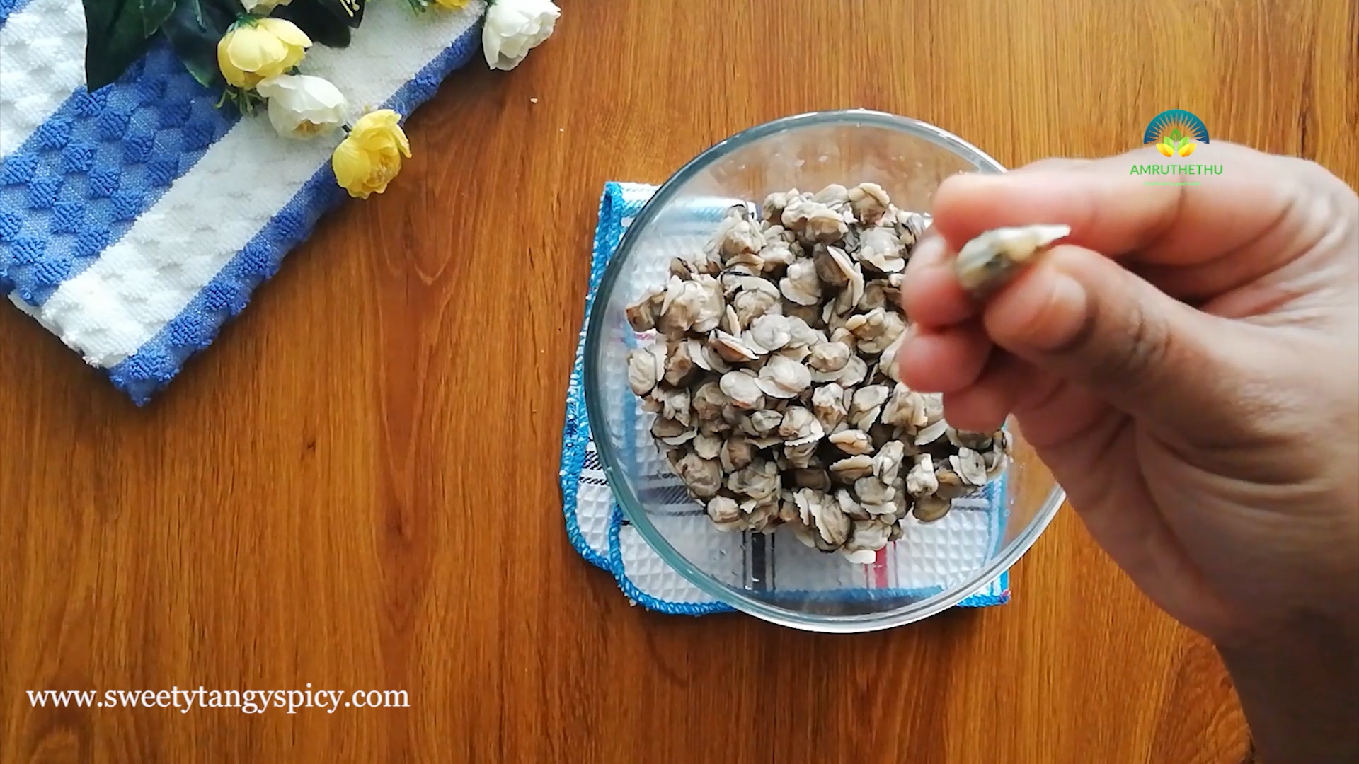 Press gently and squeeze towards the black colored portion of each clam