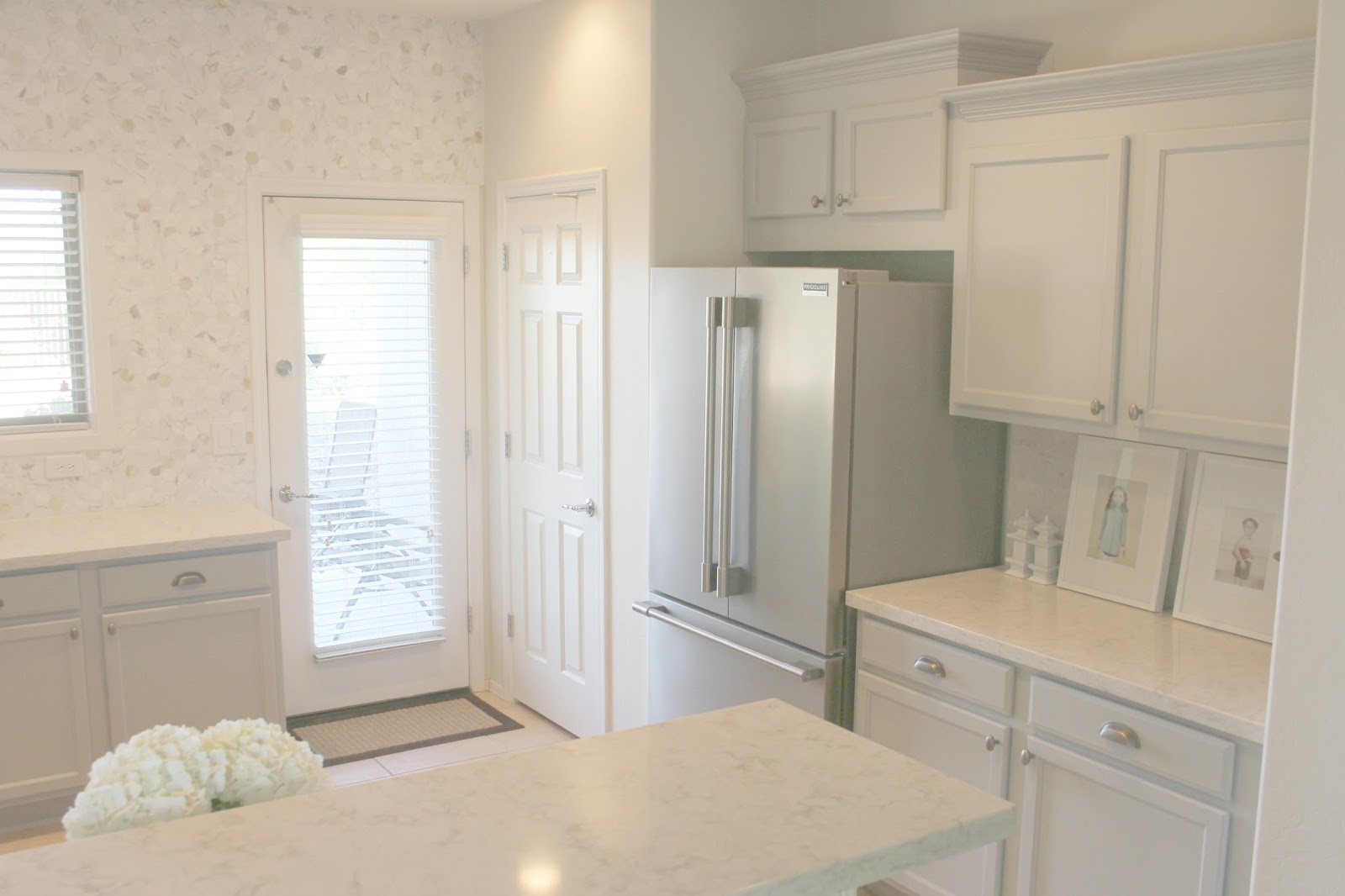 Serene Nordic French style kitchen renovation with pastels and grey cabinets by Hello Lovely studio