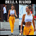 Bella Hadid in orange pants and white crop top in New York on July 22
