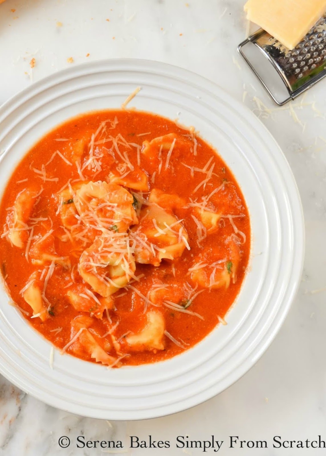 Creamy Tomato Tortellini Soup is an easy to make recipe in under 30 minutes. Great for lunch or dinner from Serena Bakes Simply From Scratch.