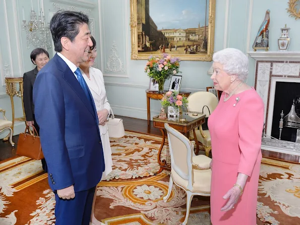 Queen Elizabeth of Great Britain hosts a private audience with Japanese Prime Minister Shinzo Abe, and his wife Akie at Buckingham Palace