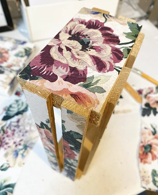 end of wooden crate with napkin decoupaged