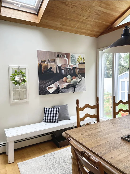 farmhouse kitchen with window and painting