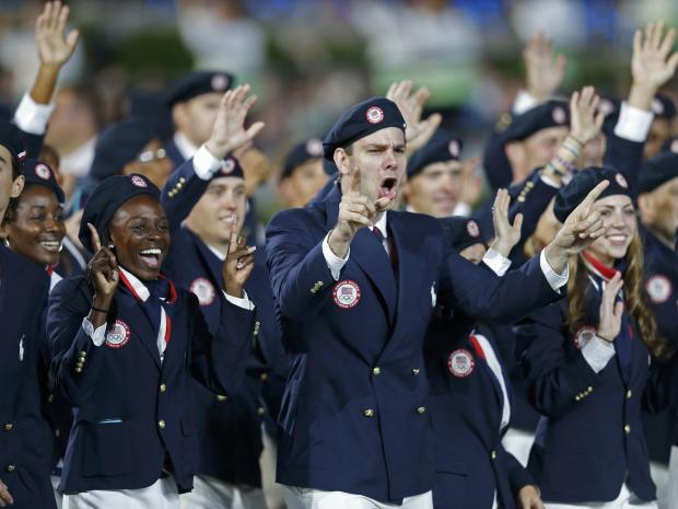 Members of the U.S. team takes part in the athlete's march during the opening ceremony of the London 2012 Olympic Games REUTERS/SUZANNE PLUNKETT 