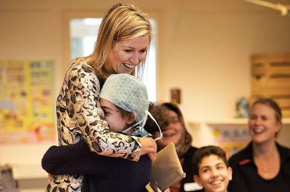 Queen Maxima of The Netherlands visited the IMC Weekendschool in Haarlem. Queen Maxima wore Natan Dress