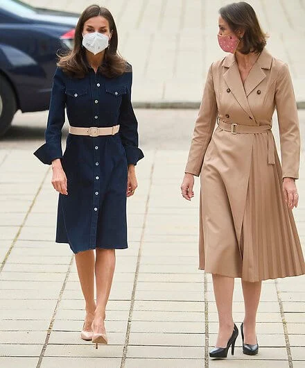 Queen Letizia wore a caddli stretch denim dress by Hugo Boss, and beethoven earrings by Tous. Minister Reyes Maroto and Minister Irene Montero