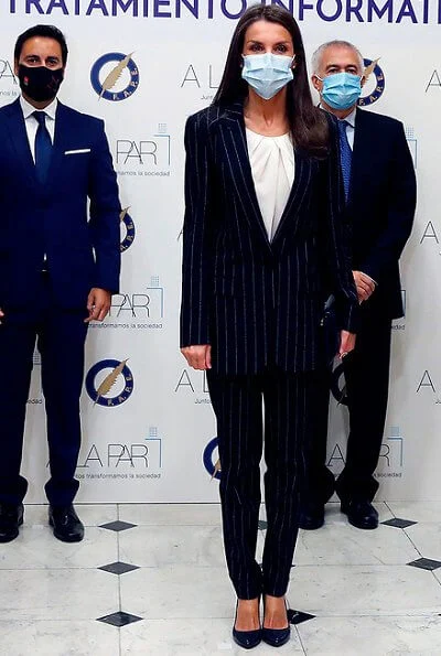 Queen Letizia wore a new striped suit blazer from Hugo Boss. Letizia wore Hugo Boss Kocani striped suit. Magrit pumps, Carolina Herrera clutch