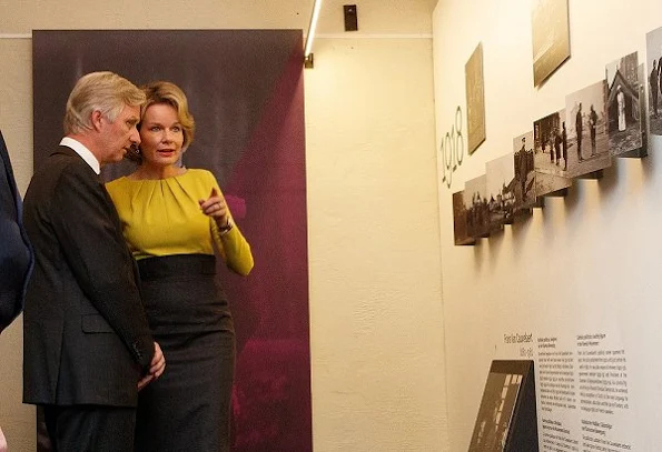 Queen Mathilde visited Rumbeke Castle. Queen Mathilde wore NATAN Coat, Gold Diamond earrings