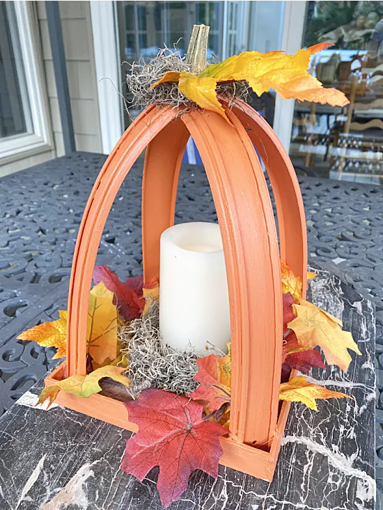 Pumpkin lantern with stem, leaves and battery candle