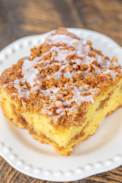 Graham Cracker Streusel Coffee Cake - seriously delicious! SO moist and the streusel topping is to die for! We couldn't resist this yummy cake!! Cake mix, vanilla pudding, sour cream, oil, eggs, vanilla, cinnamon, graham cracker crumbs, brown sugar, pecans and butter. Great for potlucks, tailgating, breakfast, brunch and dessert. #breakfast #cake #dessert #coffeecake Graham Cracker Streusel Coffee Cake - seriously delicious! SO moist and the streusel topping is to die for! We couldn't resist this yummy cake!! Cake mix, vanilla pudding, sour cream, oil, eggs, vanilla, cinnamon, graham cracker crumbs, brown sugar, pecans and butter. Great for potlucks, tailgating, breakfast, brunch and dessert. #breakfast #cake #dessert #coffeecake