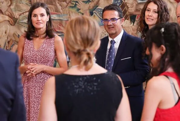 Queen Letizia wore a v-neck zig-zag print midi dress by Carolina Herrera and Lodi burgundy suede ankle strap pumps