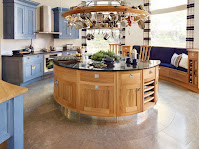 Unique chic kitchen island design inspiration with round shape and dark granite countertops