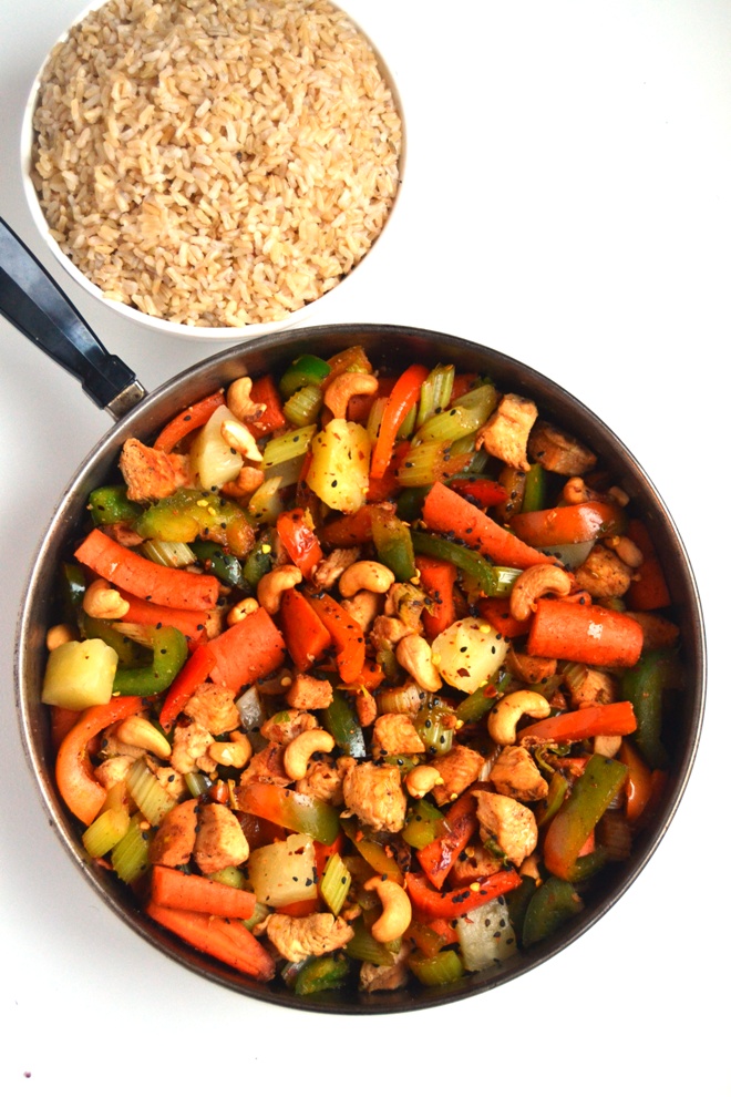 Easy Cashew Chicken is ready in just 15 minutes and is the perfect lighter stir-fry with chicken, cashews, peppers, carrots, pineapple, celery and a delicious homemade sauce! www.nutritionistreviews.com