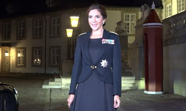Crown Princess Mary wore the official uniform worn by Danish female navy officers. Queen Margrethe wore a lace tulle gown