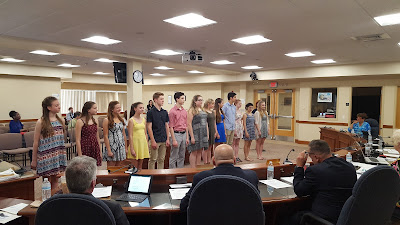 The Electric Youth being introduced to the Town Council before their song performance