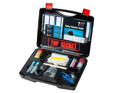 A plastic brief case with kit for being a detective in