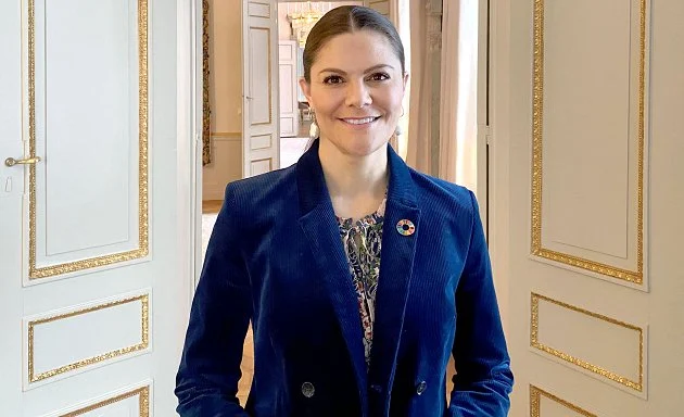 Crown Princess Victoria wore a tuva navy cord suit from Dagmar and baroque pearl earrings from Cravingfor Jewellery