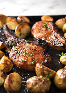 Oven Baked Pork Chops - Slathered in a tasty rub made with pantry ingredients, then baked to perfection. Add some potatoes and veggies for a one sheet pan meal! www.recipetineats.com