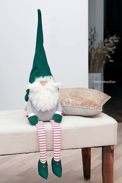 sitting Christmas gnome named Karl by sewing patterns of Zatinatskaya Natalia