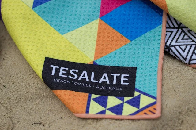 A close up of the Tesalate towel and logo