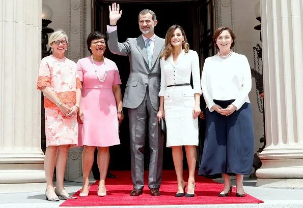 Queen Letizia wore Felipe Varela white dress and Magrit pumps at the Mardi Gras Indians show at New Orleans Museum of Art in City Park