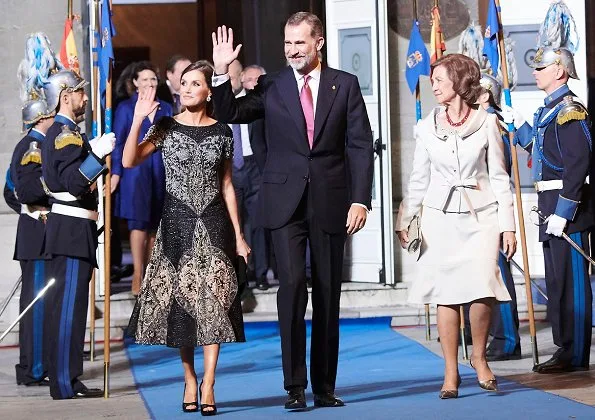 King Felipe and Queen Sofia at Princess of Asturias Awards 2018 ceremony. Queen Letizia wore Felipe Varela dress and Magrit pumps