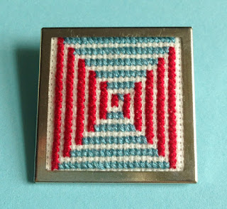 Floss & Fleece: cross-stitch op art pin