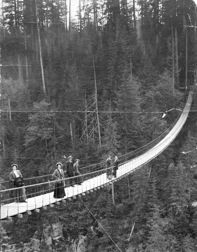 These vintage photographs capture people crossing the famous Capilano Suspension Bridge in Vancouver  1890 1910 - 19