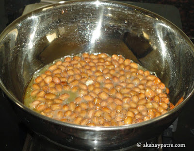 frying peanuts for poha chiwda