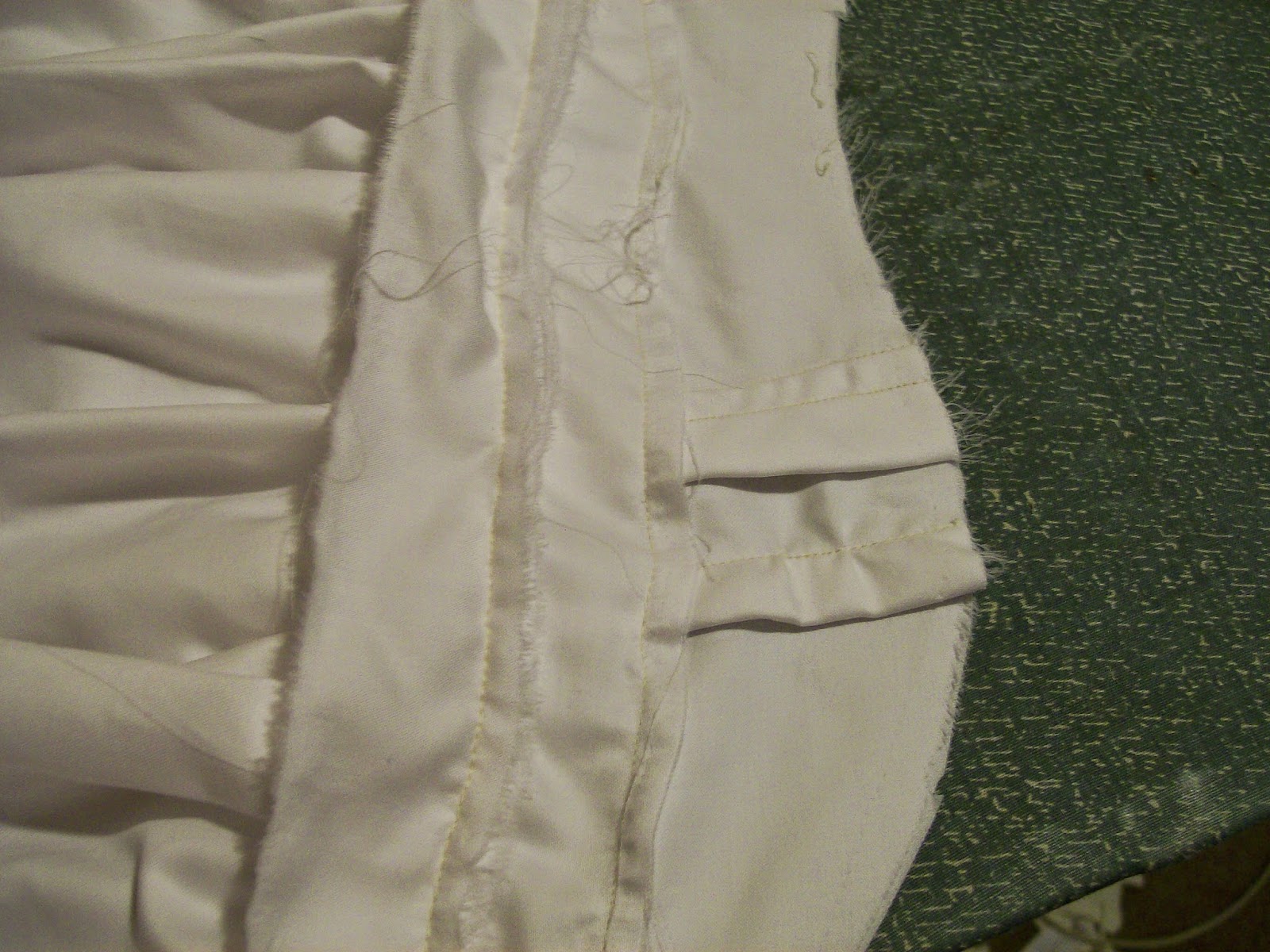 Trimming the bodice. Trimming the bodice.