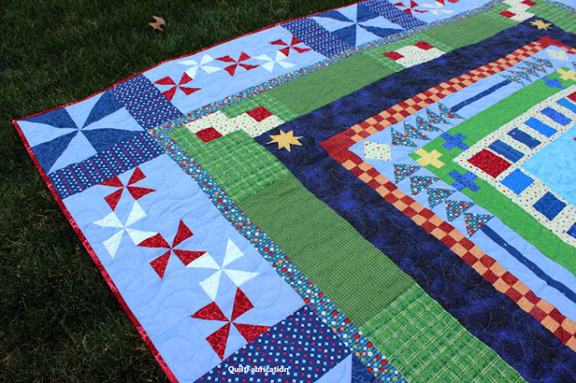 red and white pinwheels on blue in a quilt's corner