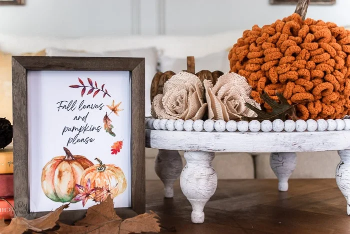 Loop yarn pumpkin on beaded wood tray with leaves and Fall printable