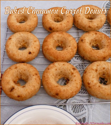 Baked Cinnamon Carrot Donuts are studded with carrots, full of cinnamon flavor, and topped with a sprinkling of cinnamon sugar. | Recipe developed by www.BakingInATornado.com | #recipe #donuts