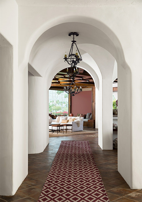 southwestern style entry with dark floor and walls painted with Benjamin Moore Atrium White