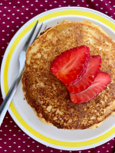 Old-fashioned cornmeal griddle cakes are pancakes made with cornmeal and topped with real maple syrup.