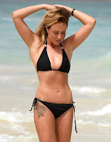 There are no mistake as Charlotte Crosby, 25, displaying the enviable curves in a black string bikini while strolling to the hotel beach of the Fancy Melia Dunas on Monday, December 17, 2015.
