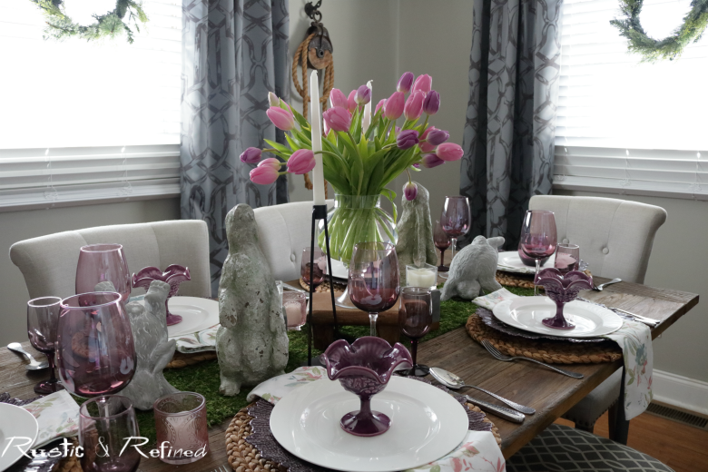 Spring tablescape using pinks, purples, moss and gorgeous concrete bunnies for a spectacular table
