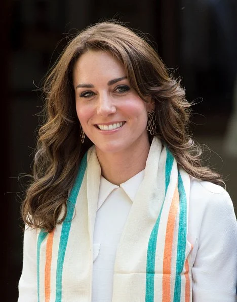 Britain's Prince William, Duke of Cambridge and his wife Catherine, Duchess of Cambridge pay tribute during a visit to Gandhi Smiriti, an Indian museum