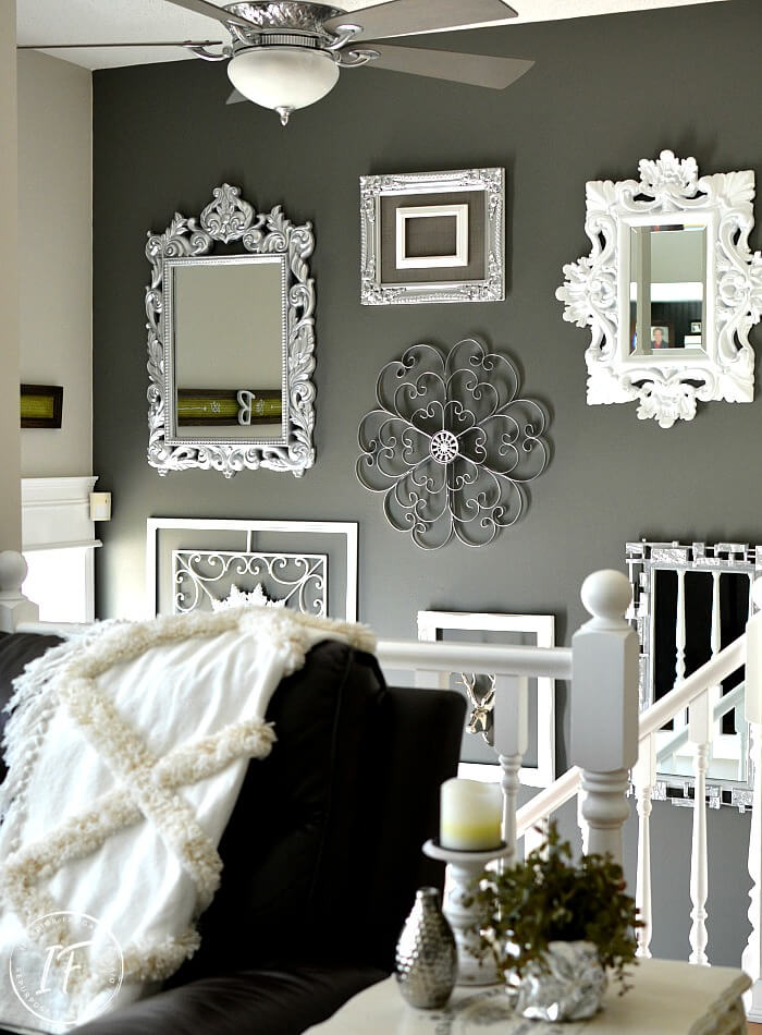 A Budget Glitz And Glam Gallery Wall Idea with upcycled thrift store mirrors and frames along with tips on how to hang gallery art the easy no measure way.