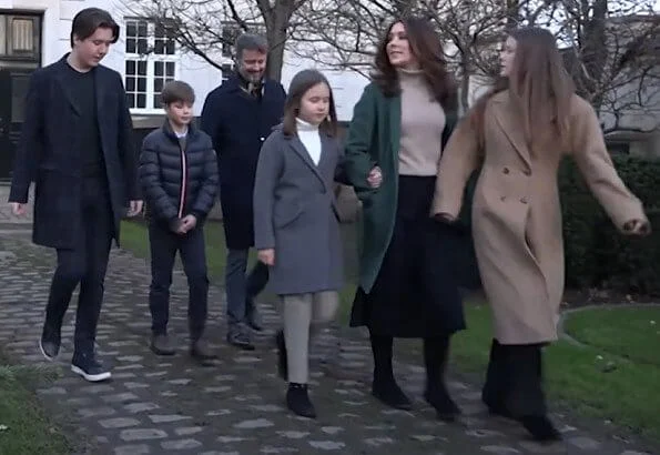 Princess Isabella wore a turtleneck sweater from Zara. camel wool coat. Crown Princess Mary wore a green wool and cashmere coat from Theory