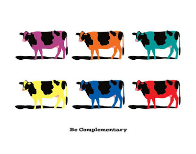 poster with multiple colored cows in complementary colors