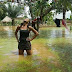 Young Slay Queen Poses In Front of Her Flooded house In Benue State (Photos)