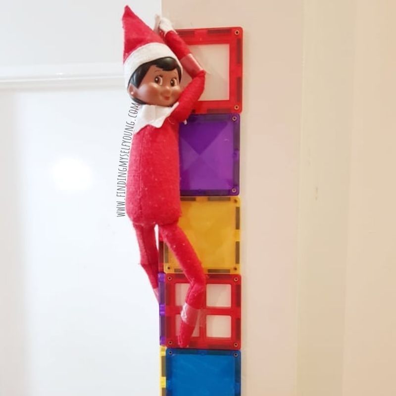 elf on the shelf climbing magnetic tile wall