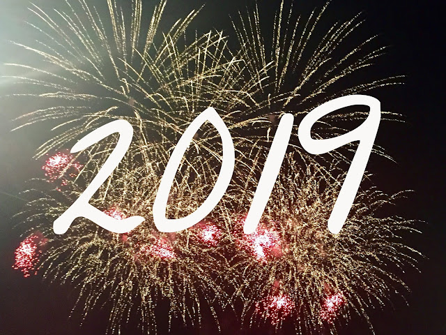 '2019' text on fireworks background