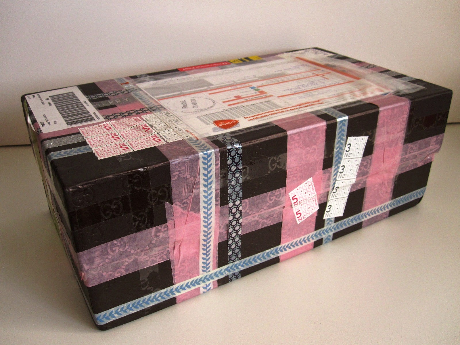 Large shoe box, wrapped with various washi tapes.There are postal sticker on the top of it.