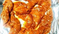 Marinated chicken on baking tray for chicken tikka kebab