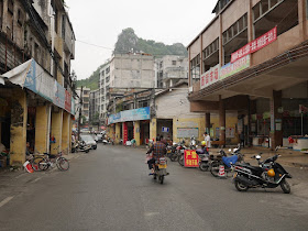 Jiefang West Road with Pingfeng Hill in the distance in Yunfu