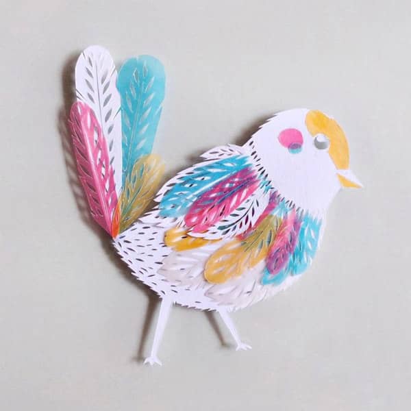 witte papercut vogel met pastel perkament accenten